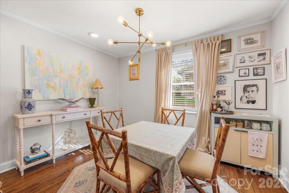 4922 Valley Stream Road Charlotte, NC 28209 - Photo 12 of 33 a view of a dining room with furniture window and wooden floor