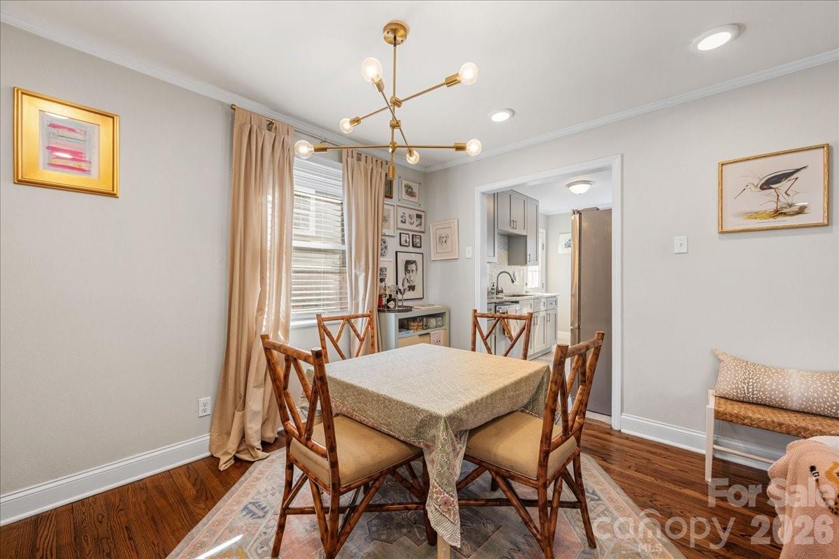 4922 Valley Stream Road Charlotte, NC 28209 - Photo 13 of 33 a view of a dining room with furniture window and wooden floor