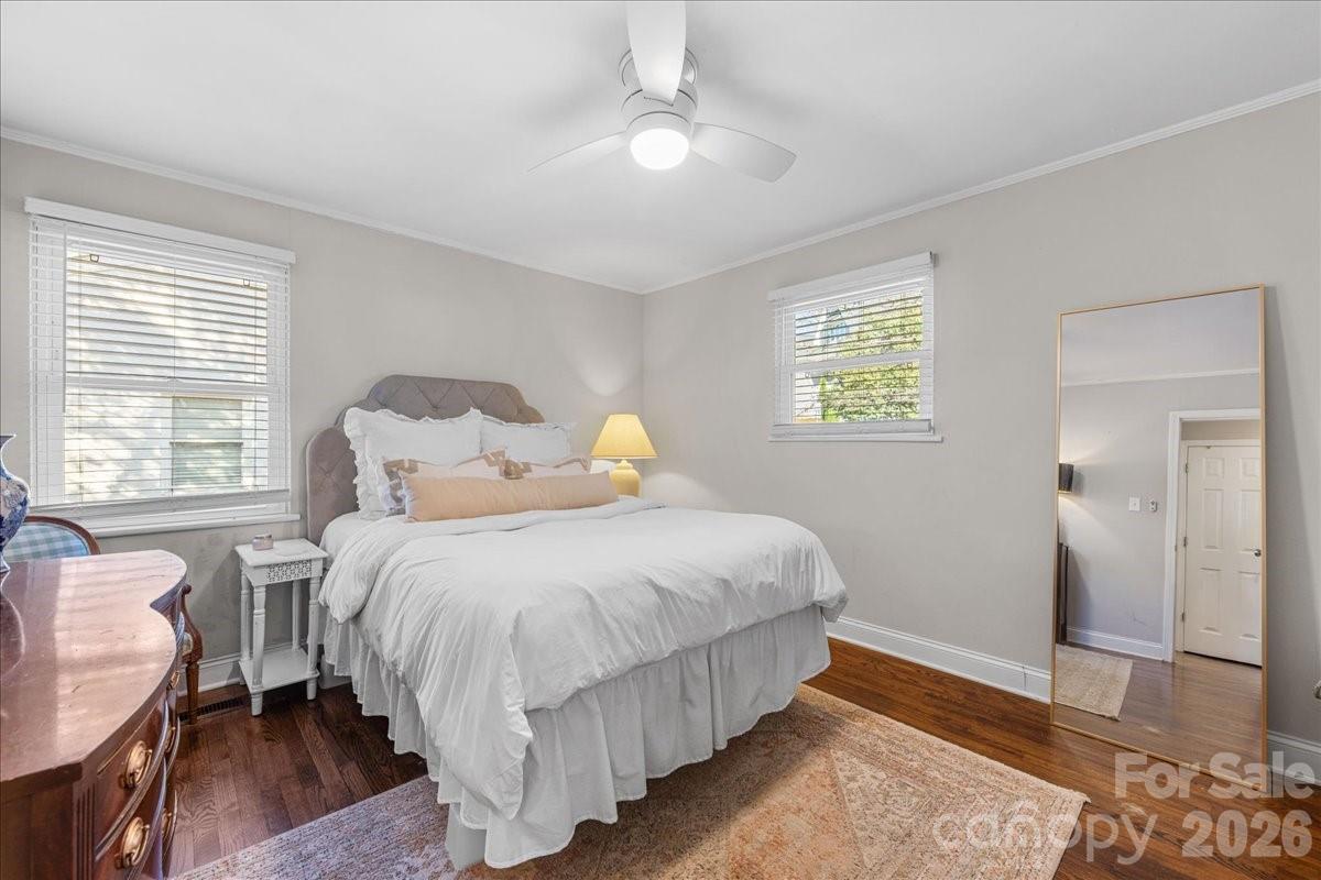 4922 Valley Stream Road Charlotte, NC 28209 - Photo 20 of 33 a bedroom with bed and window