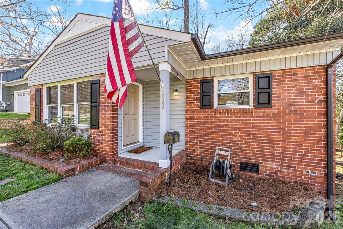 4922 Valley Stream Road Charlotte, NC 28209 - Photo 2 of 33 a view of a house with backyard and sitting area