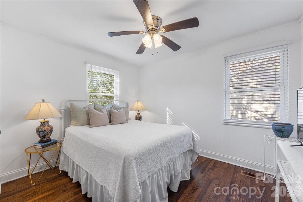 4922 Valley Stream Road Charlotte, NC 28209 - Photo 24 of 33 a bedroom with a bed and a window