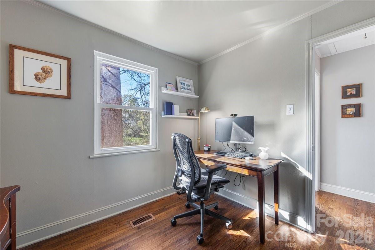 4922 Valley Stream Road Charlotte, NC 28209 - Photo 26 of 33 a workspace with furniture and wooden floor