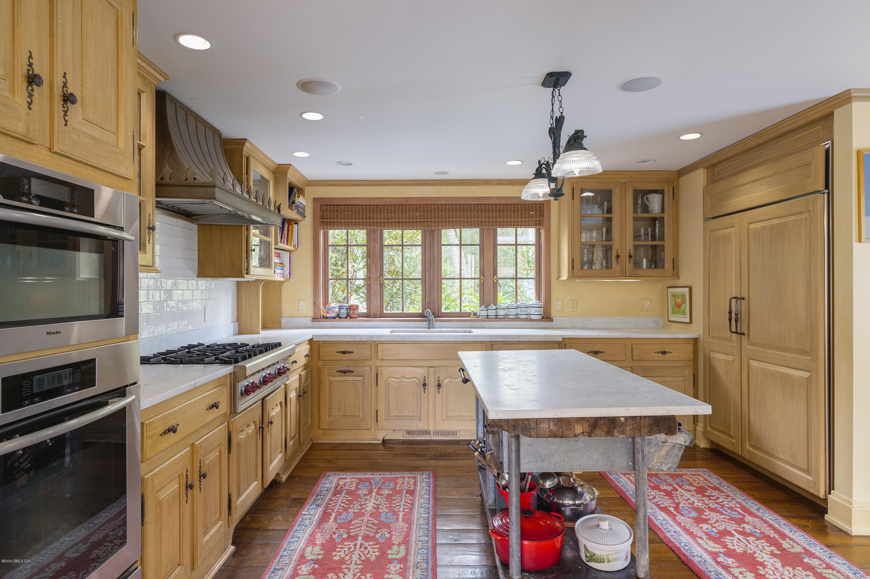 10 Frost Road Greenwich, CT 06830 - Photo 12 of 24 a kitchen with granite countertop a stove a sink and a refrigerator