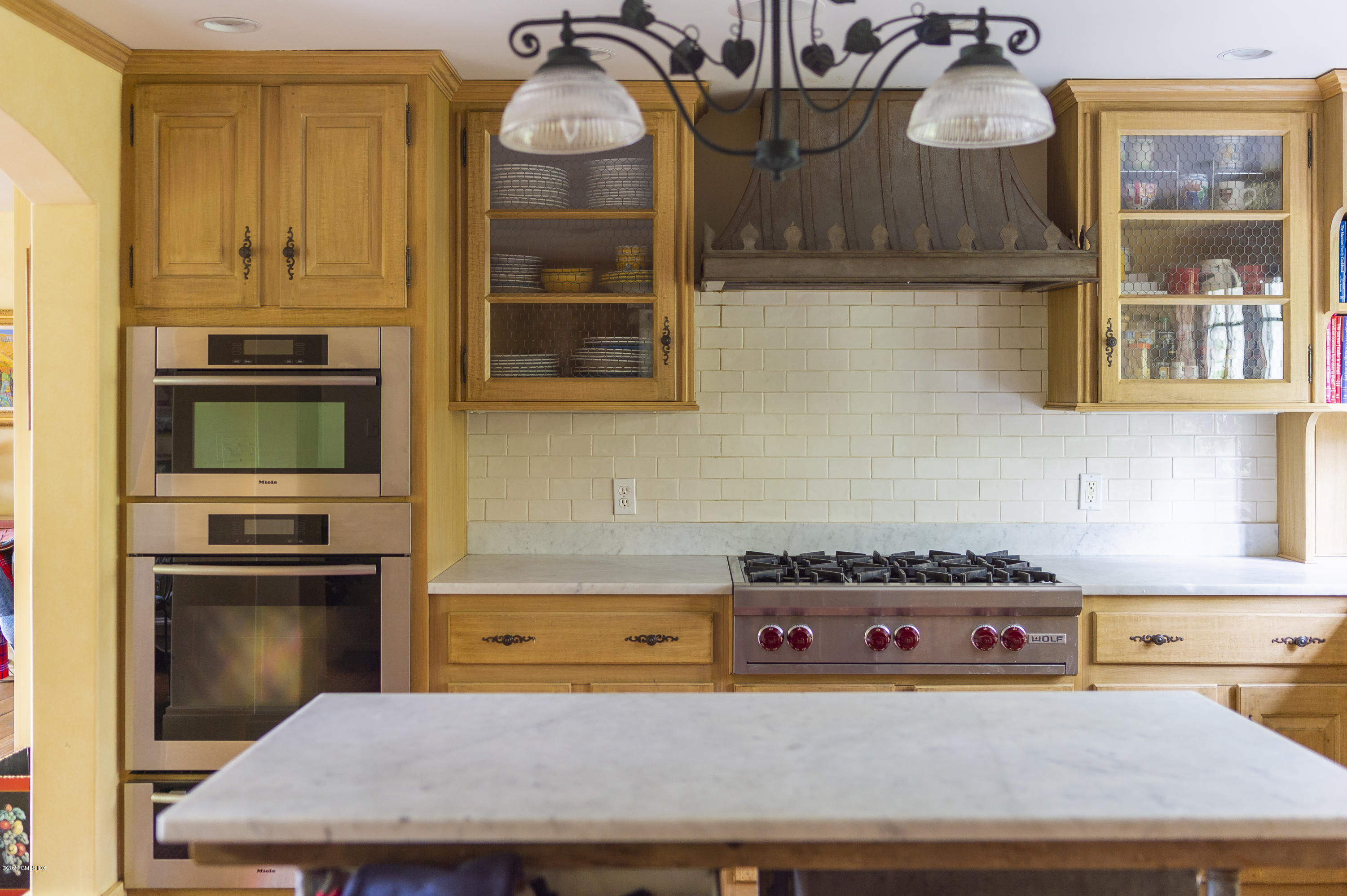 10 Frost Road Greenwich, CT 06830 - Photo 13 of 24 a kitchen with stainless steel appliances granite countertop a stove a sink and a microwave