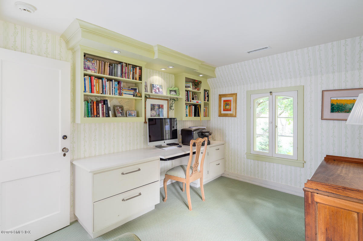 10 Frost Road Greenwich, CT 06830 - Photo 14 of 24 a view of a workspace with furniture and a window