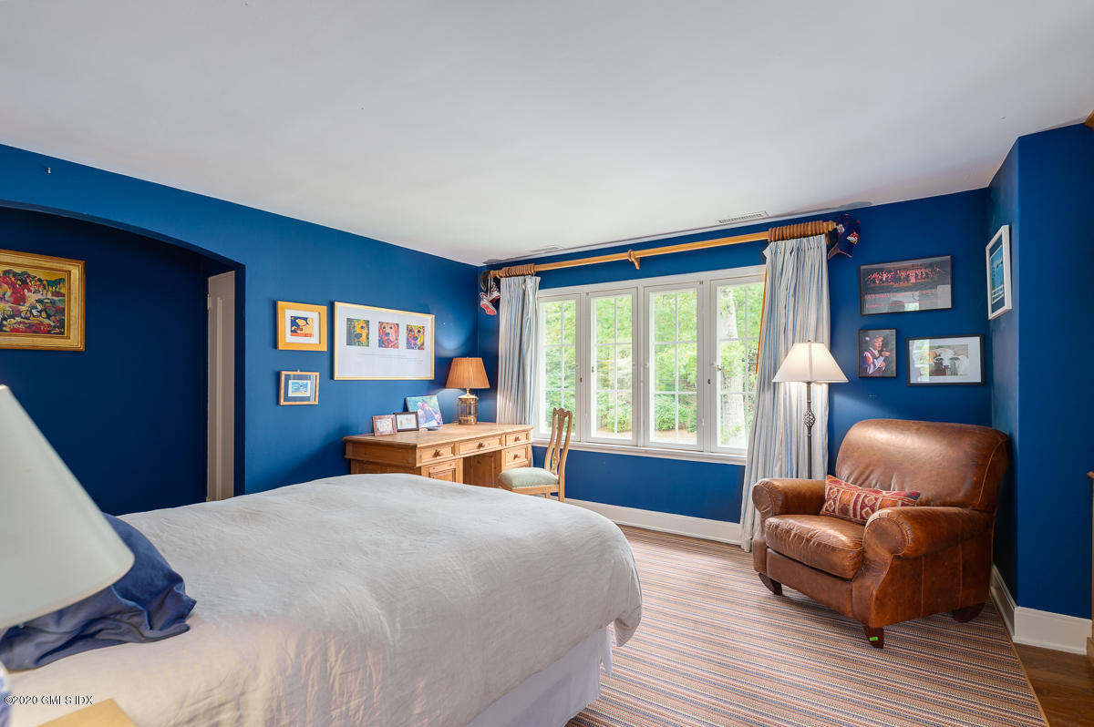 10 Frost Road Greenwich, CT 06830 - Photo 17 of 24 a bedroom with furniture and a window