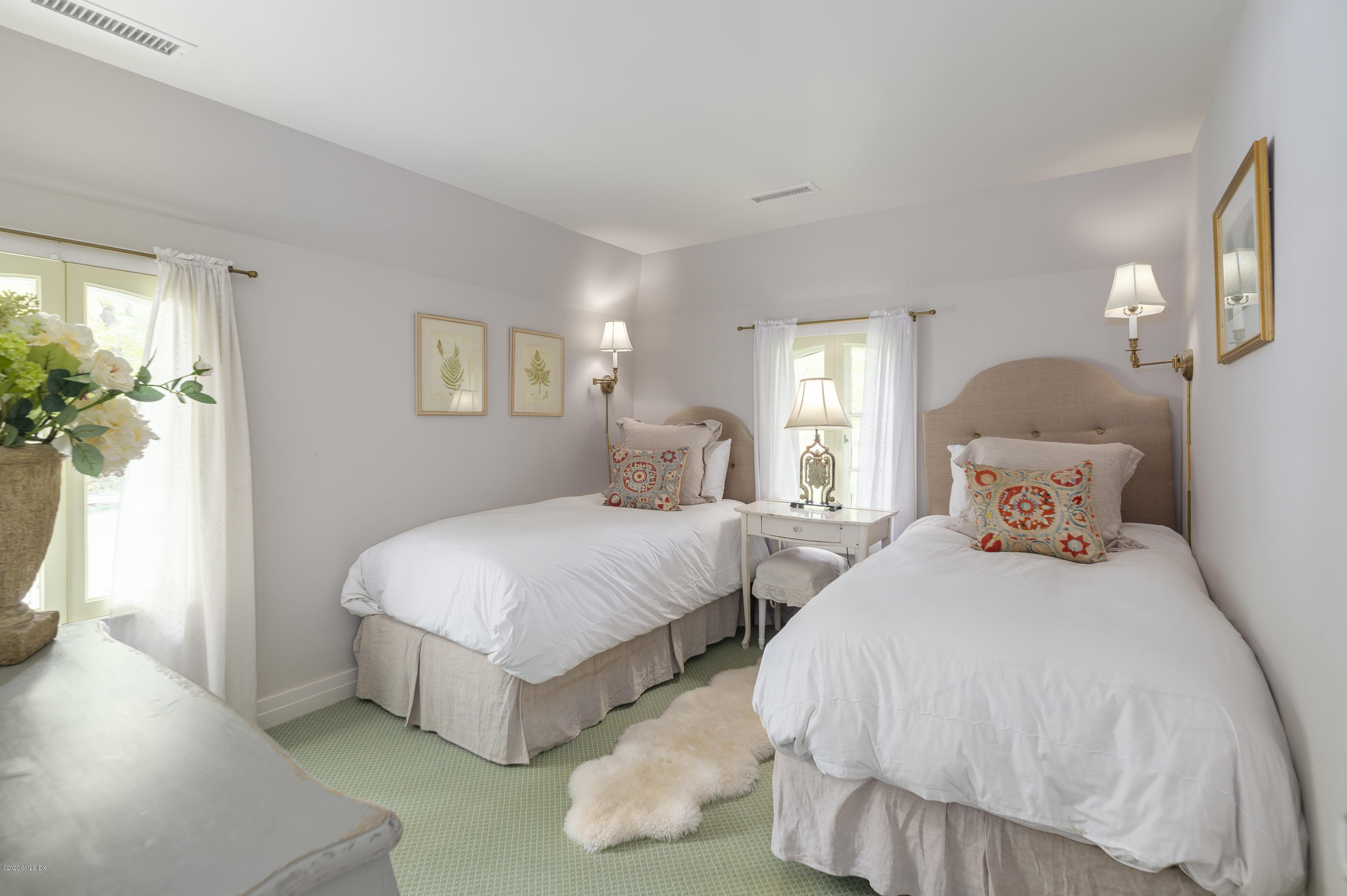 10 Frost Road Greenwich, CT 06830 - Photo 21 of 24 a bedroom with two beds and a potted plant