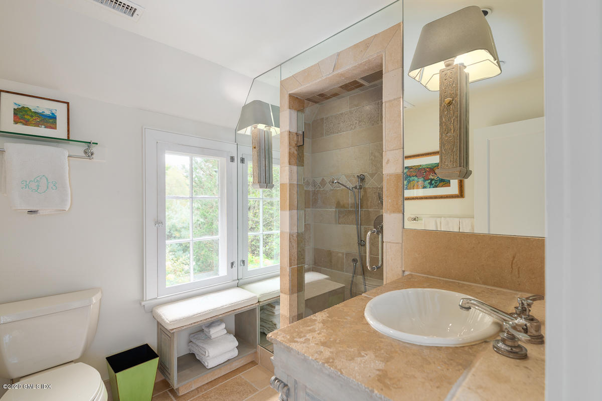 10 Frost Road Greenwich, CT 06830 - Photo 22 of 24 a bathroom with a granite countertop sink and a mirror