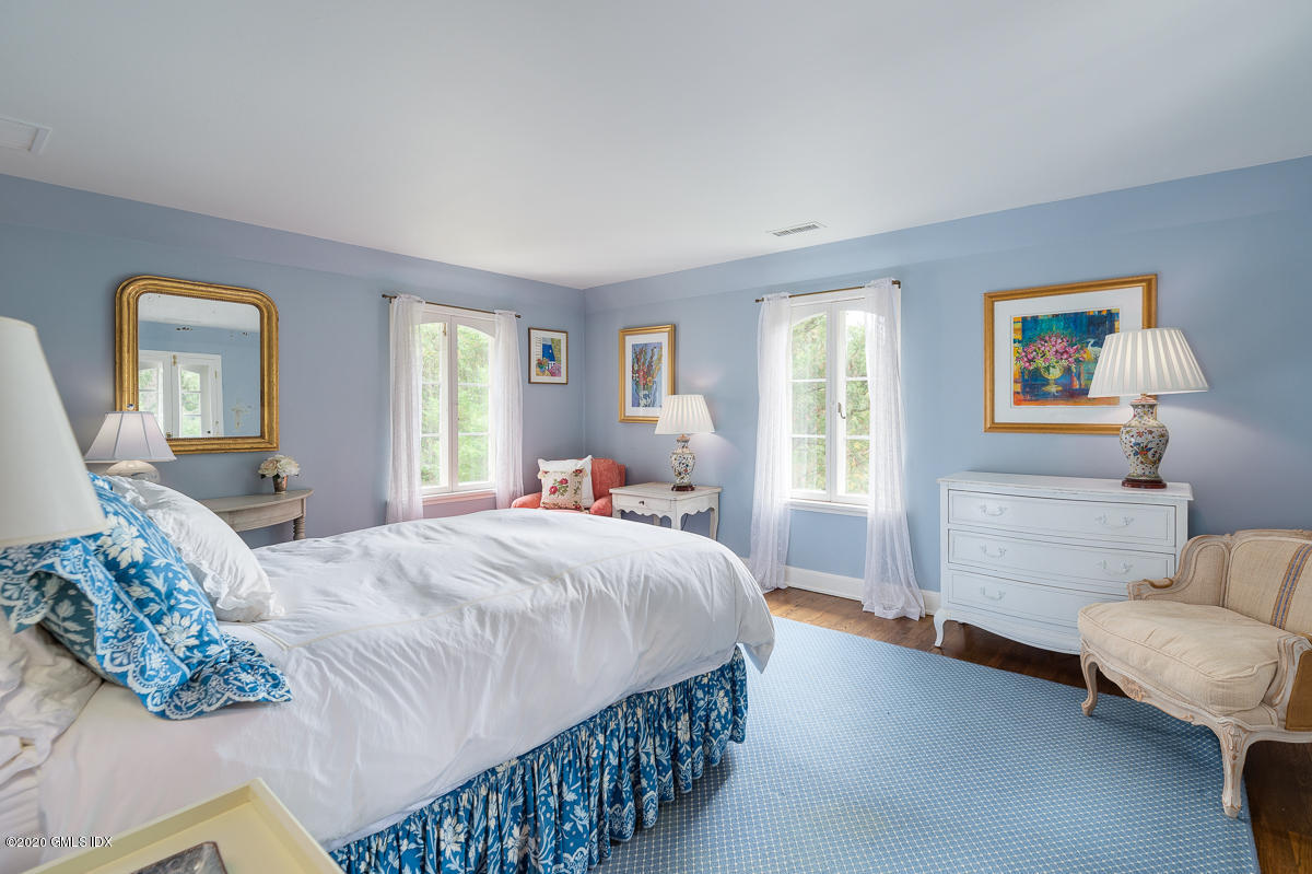 10 Frost Road Greenwich, CT 06830 - Photo 23 of 24 a bedroom with a bed couch and window