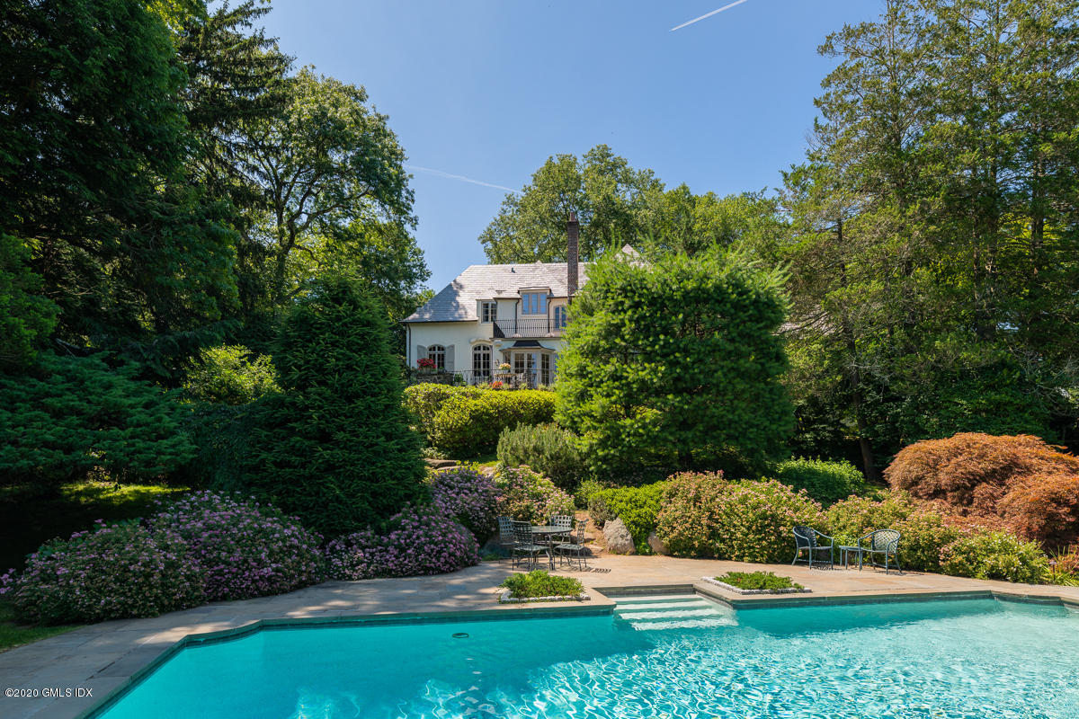 10 Frost Road Greenwich, CT 06830 - Photo 3 of 24 a view of a garden with plants and large trees