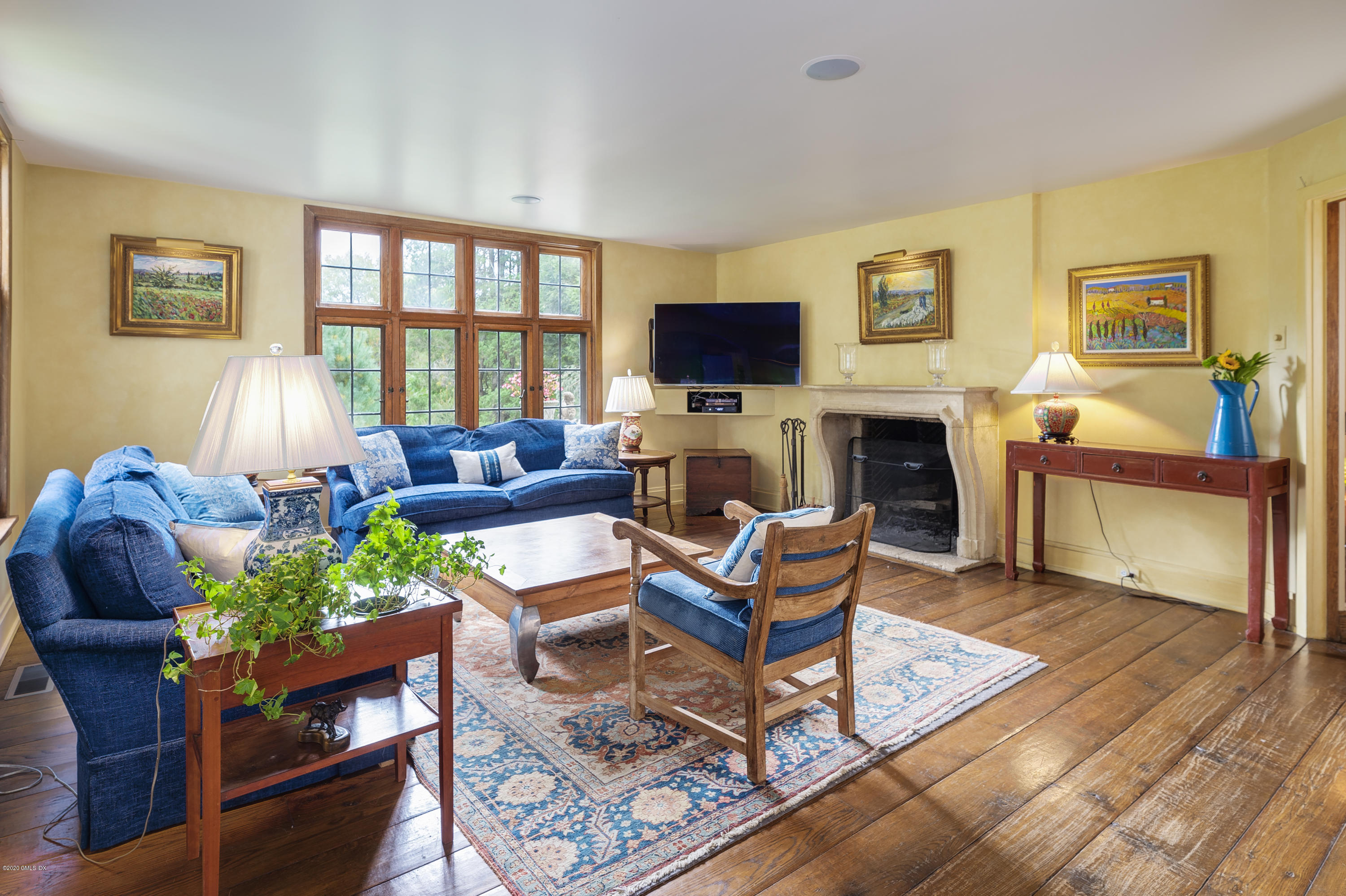 10 Frost Road Greenwich, CT 06830 - Photo 9 of 24 a living room with fireplace furniture and a flat screen tv