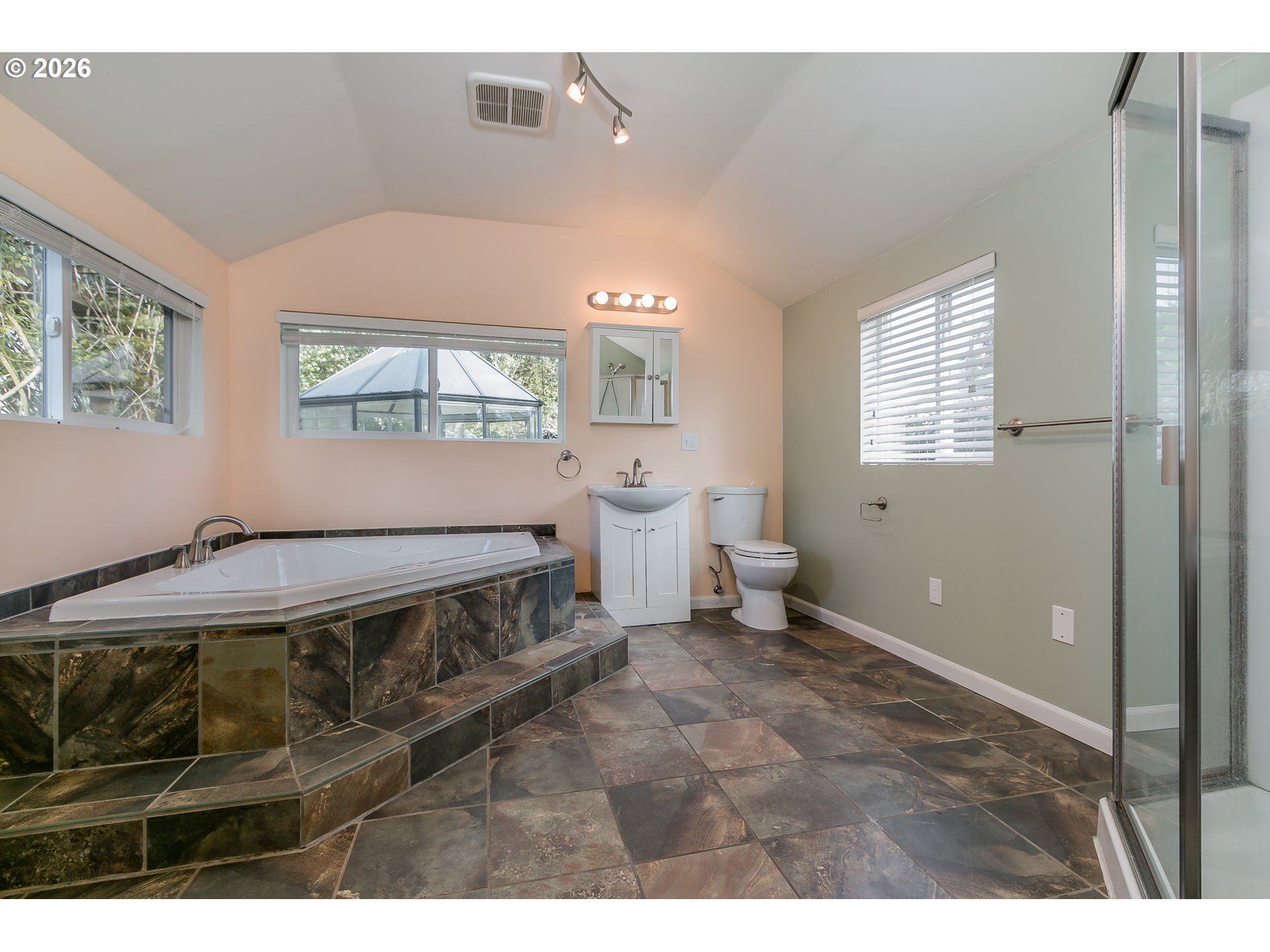 715 Ellsworth Street Eugene, OR 97402 - Photo 11 of 26 a bedroom with a bed and a window