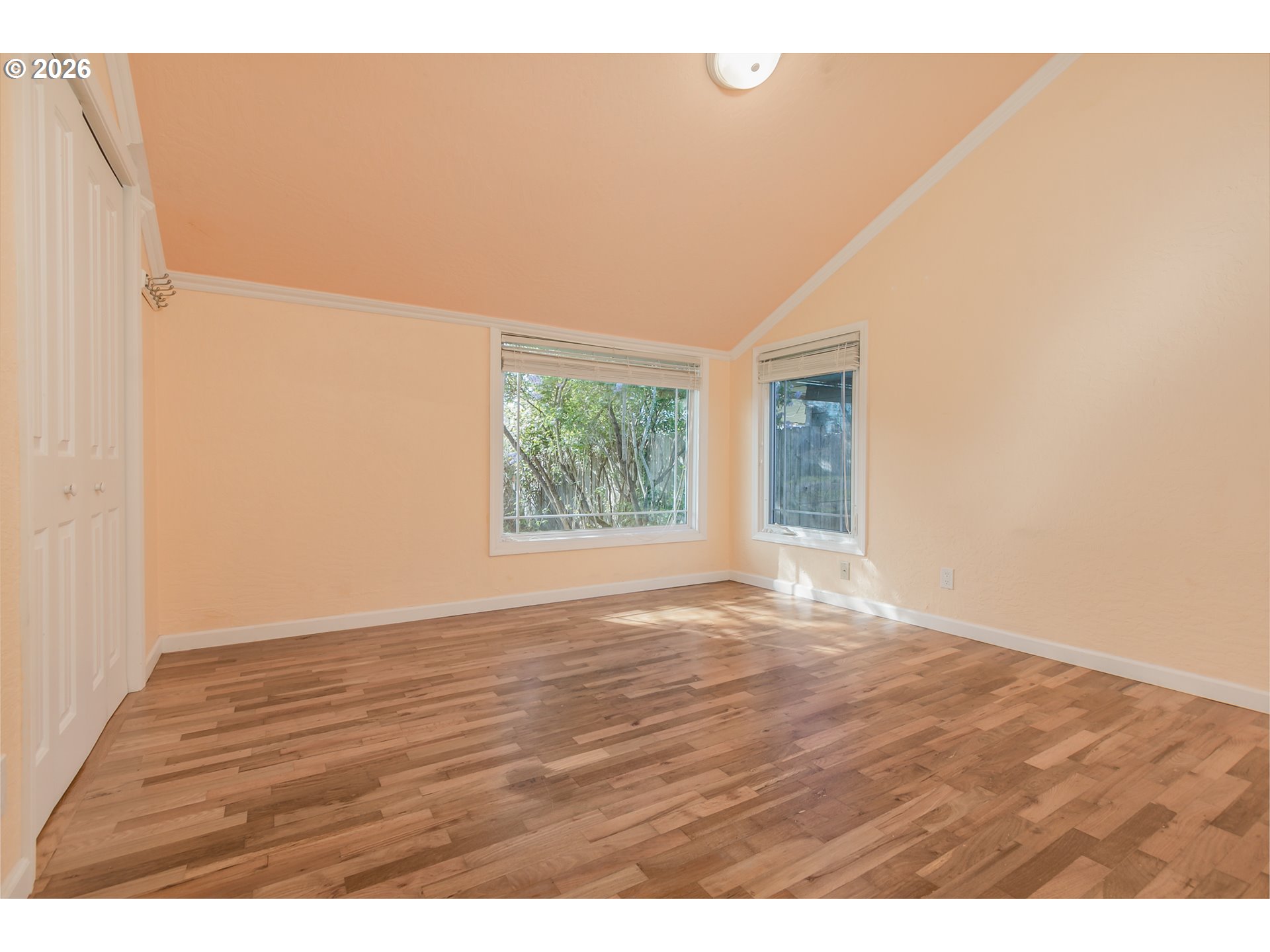 715 Ellsworth Street Eugene, OR 97402 - Photo 12 of 26 a view of an empty room with wooden floor and a window