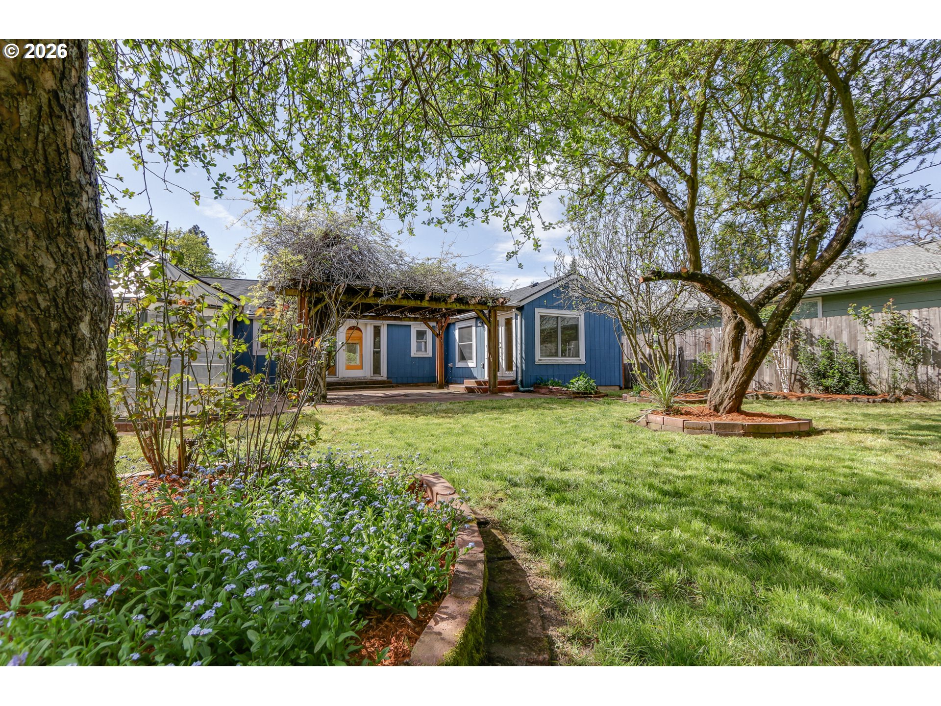 715 Ellsworth Street Eugene, OR 97402 - Photo 19 of 26 a view of a house with yard and sitting area