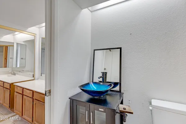 a view of a storage & utility room with a stove fridge
