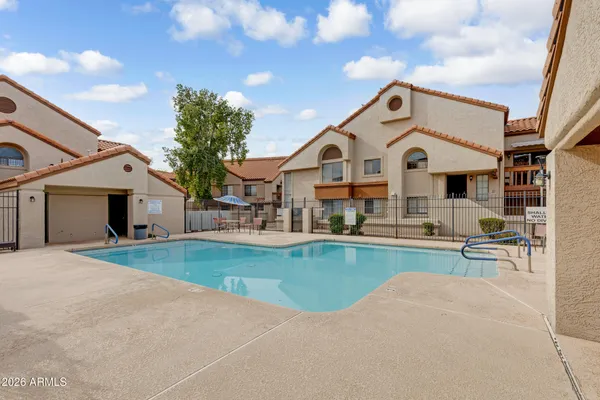 a view of a white house with a outdoor space