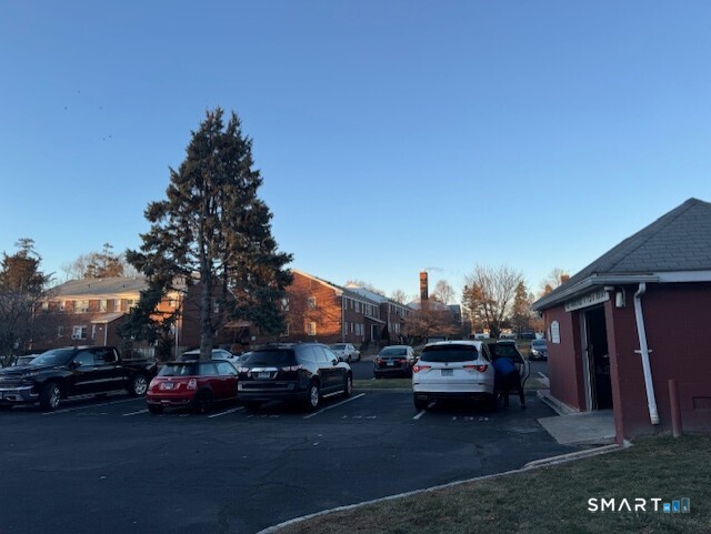 236 Glenbrook Road, Unit 12A Stamford, CT 06906 - Photo 11 of 18 a car parked in front of a house