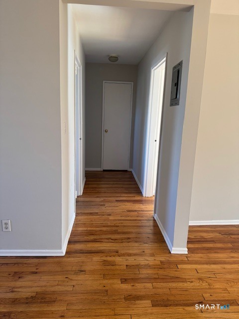 236 Glenbrook Road, Unit 12A Stamford, CT 06906 - Photo 13 of 18 a view of a hallway with wooden floor