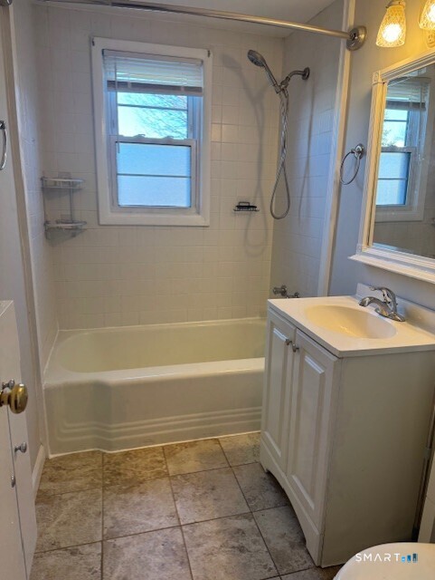 236 Glenbrook Road, Unit 12A Stamford, CT 06906 - Photo 14 of 18 a bathroom with a bathtub and shower
