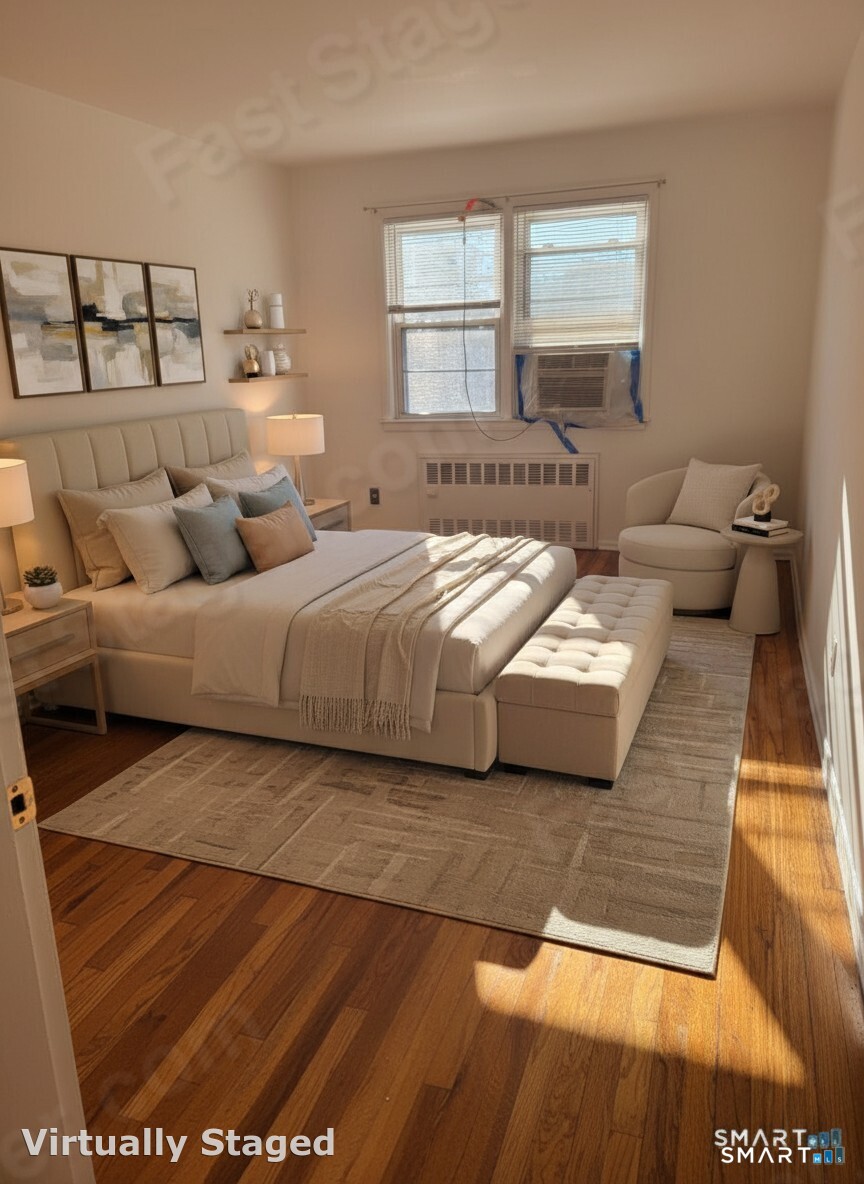 236 Glenbrook Road, Unit 12A Stamford, CT 06906 - Photo 5 of 18 a bedroom with a bed and window