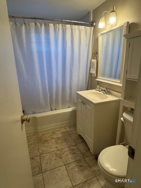 236 Glenbrook Road, Unit 12A Stamford, CT 06906 - Photo 7 of 18 a bathroom with a sink toilet and shower