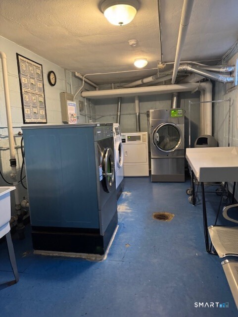 236 Glenbrook Road, Unit 12A Stamford, CT 06906 - Photo 8 of 18 a utility room with dryer and washer