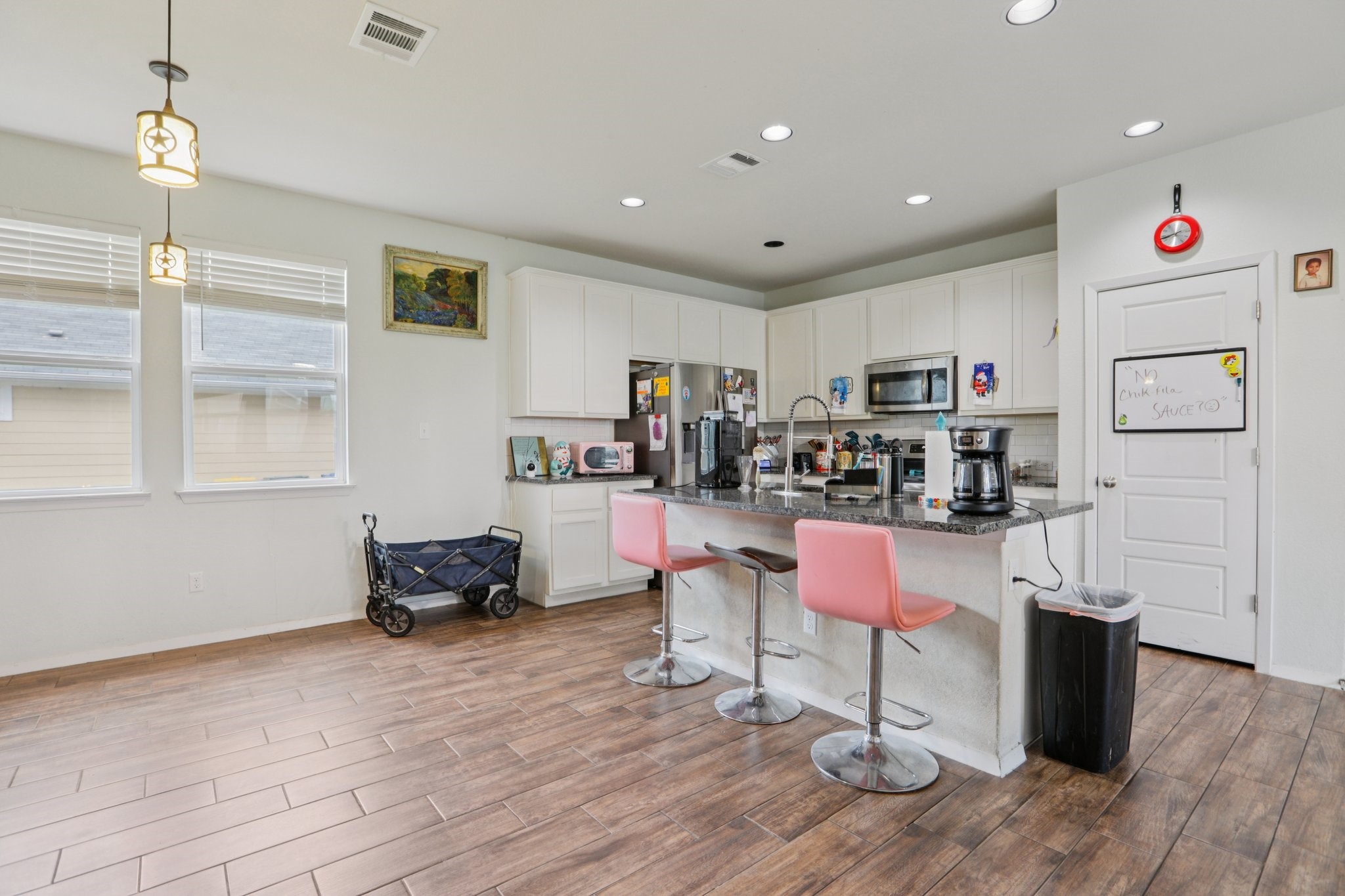 119 Saranac Drive Elgin, TX 78621 - Photo 13 of 41 a living room with furniture and a wooden floor