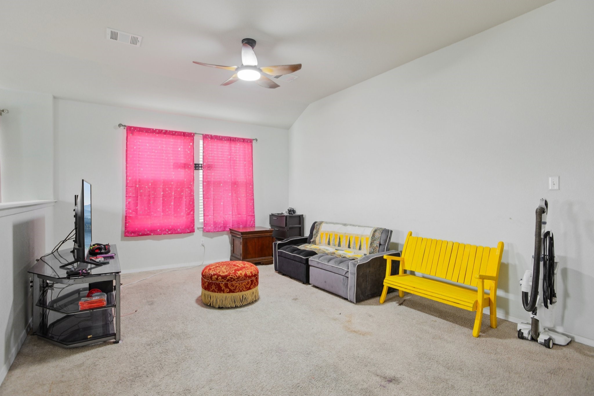 119 Saranac Drive Elgin, TX 78621 - Photo 24 of 41 a room with furniture and a flat screen tv