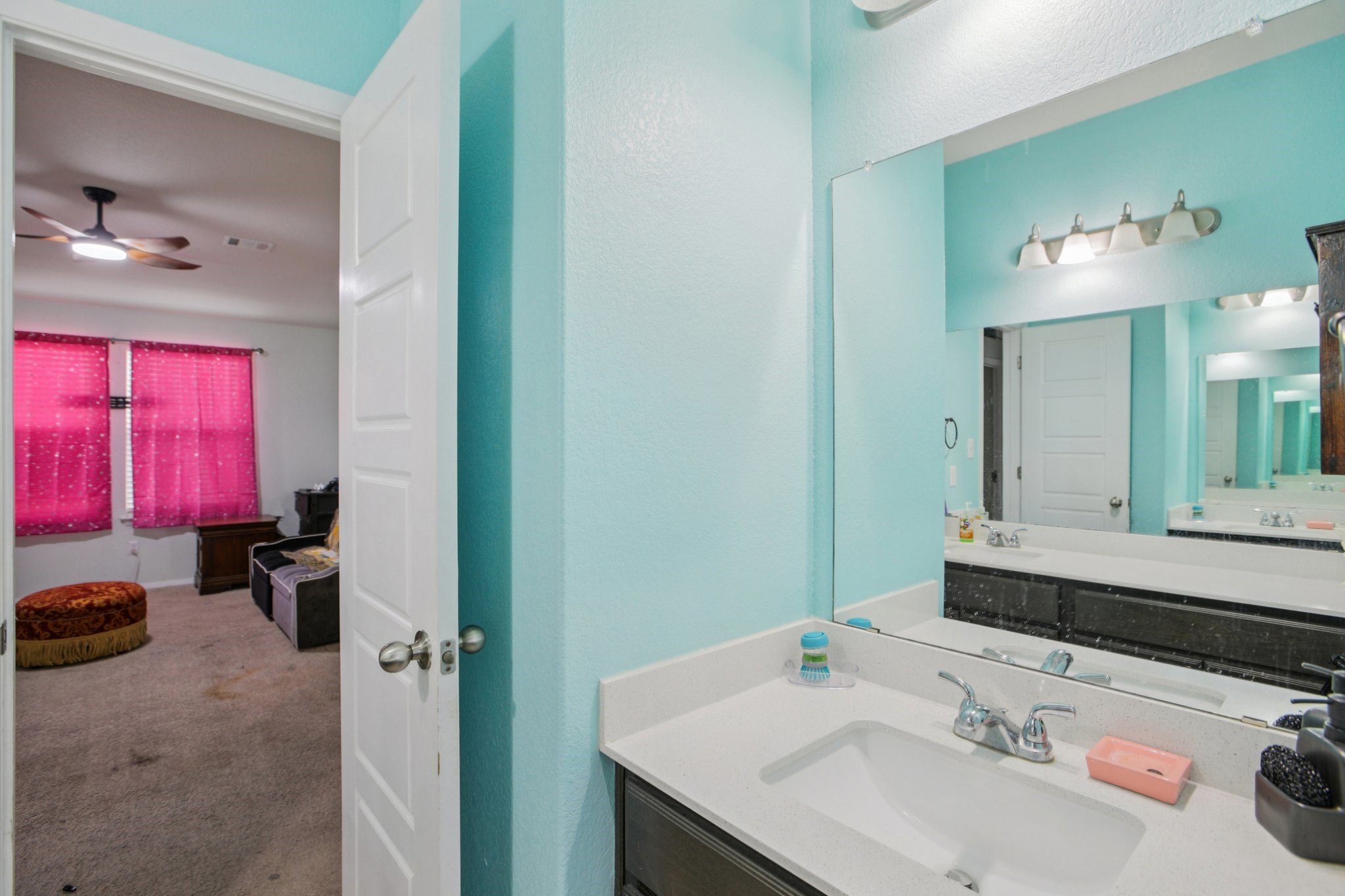 119 Saranac Drive Elgin, TX 78621 - Photo 30 of 41 a bathroom with a sink and a mirror