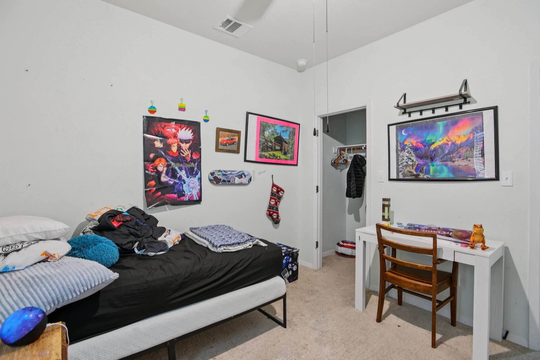 119 Saranac Drive Elgin, TX 78621 - Photo 33 of 41 a bedroom with furniture and a bookshelf