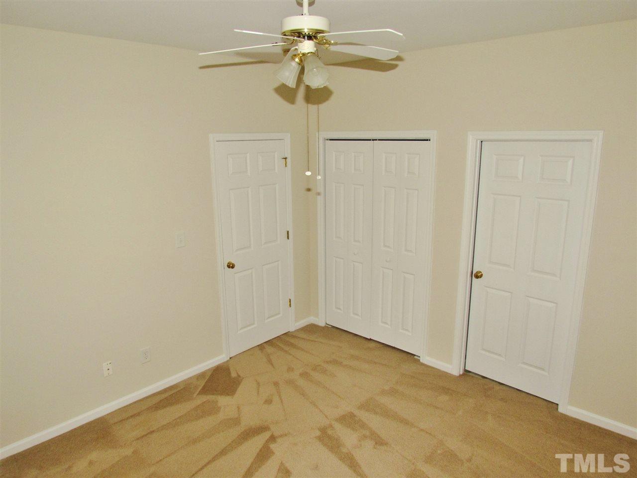 2700 Andover Glen Road Raleigh, NC 27604 - Photo 14 of 25 a view of a chandelier fan in a empty room