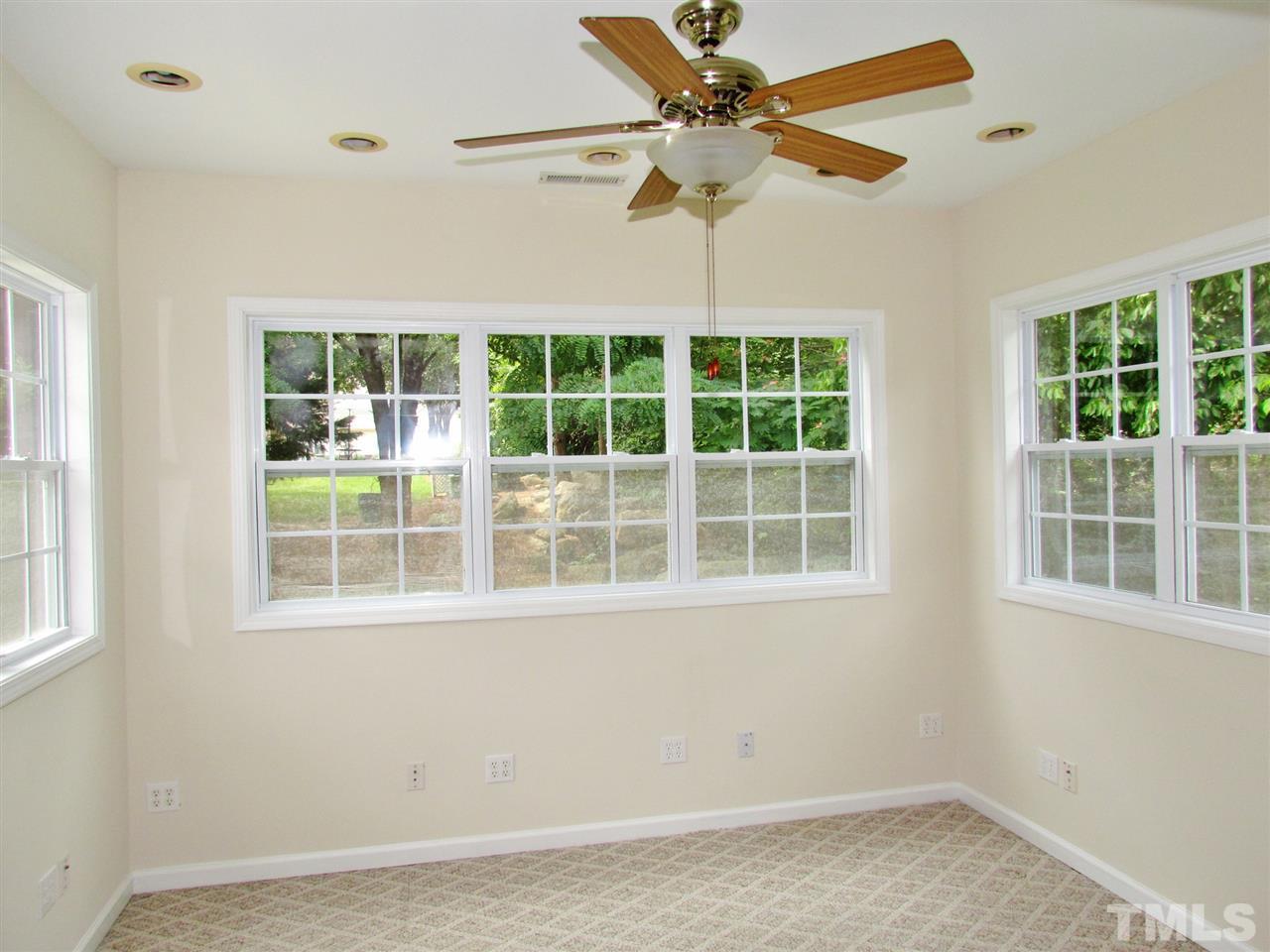 2700 Andover Glen Road Raleigh, NC 27604 - Photo 17 of 25 an empty room with a window and a ceiling fan