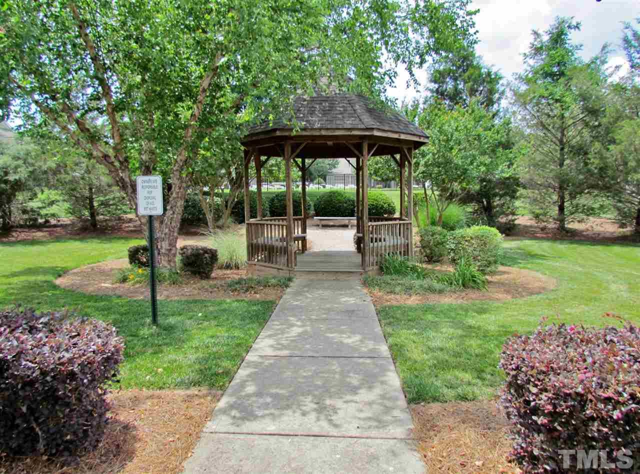2700 Andover Glen Road Raleigh, NC 27604 - Photo 23 of 25 a view of a garden with a slide