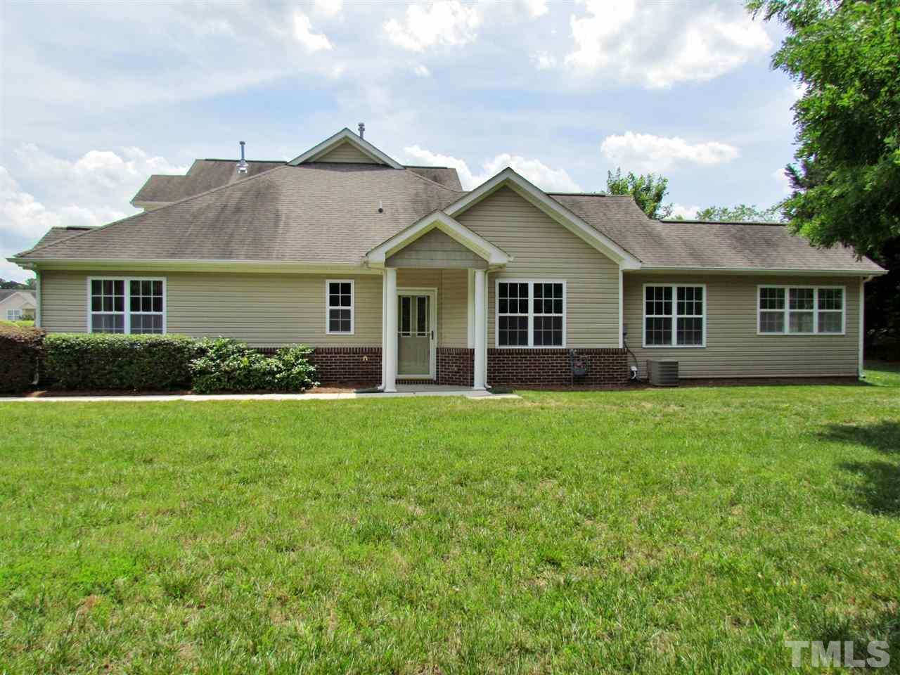 2700 Andover Glen Road Raleigh, NC 27604 - Photo 4 of 25 a view of a house with a yard and potted plants
