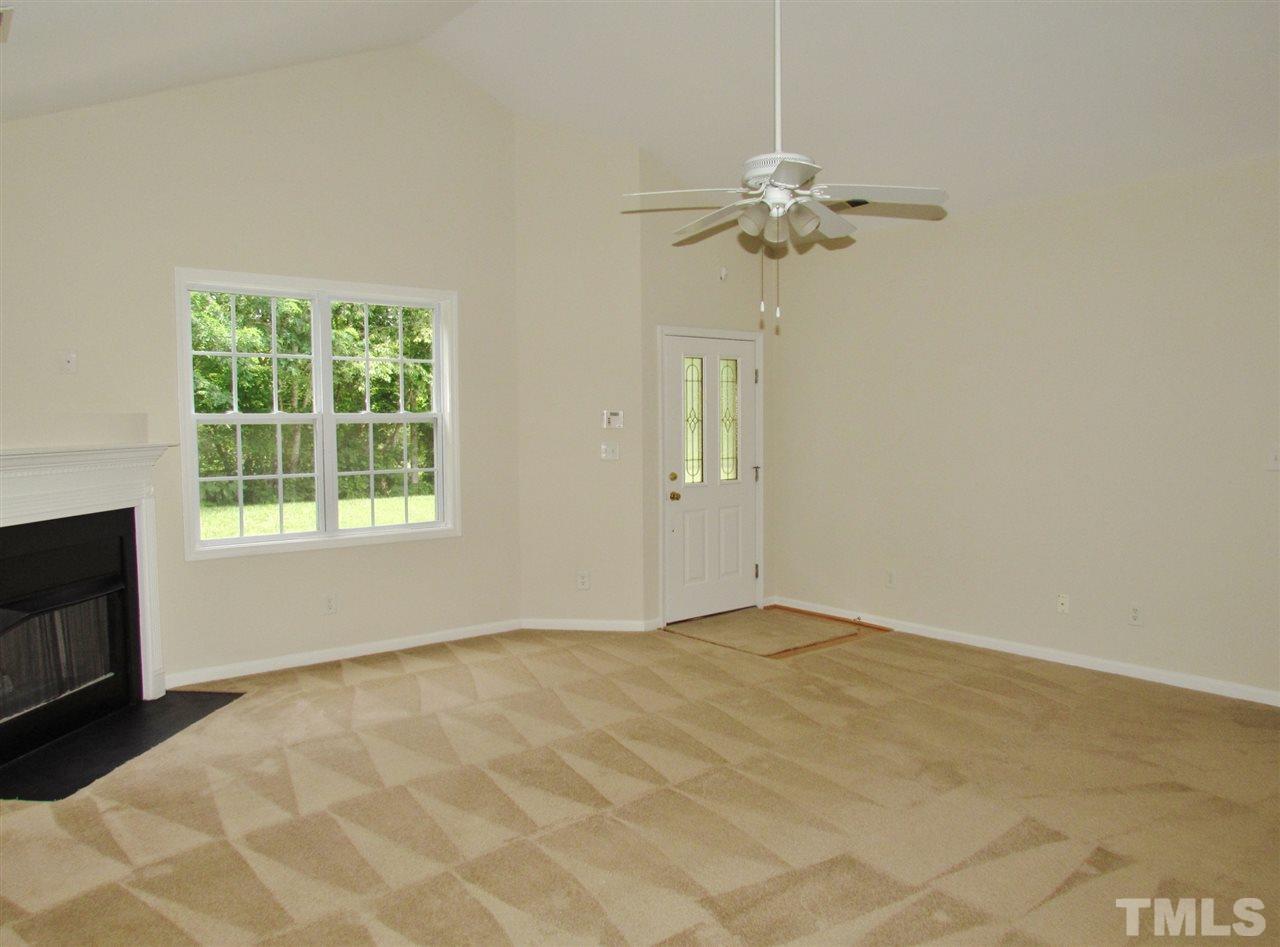 2700 Andover Glen Road Raleigh, NC 27604 - Photo 8 of 25 a view of a livingroom with a chandelier fan and a window