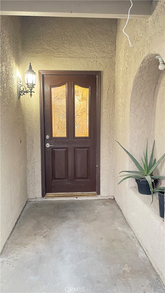 14425 Manzano Road Victorville, CA 92392 - Photo 5 of 21 a view of entryway with wooden floor
