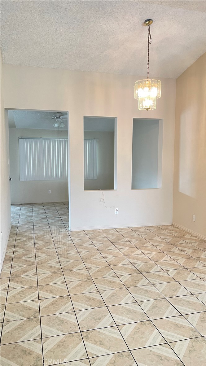 14425 Manzano Road Victorville, CA 92392 - Photo 7 of 21 a view of empty room with window