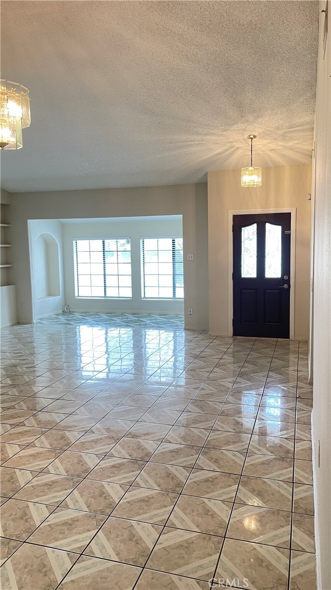 14425 Manzano Road Victorville, CA 92392 - Photo 8 of 21 a view of entryway and hall with a window