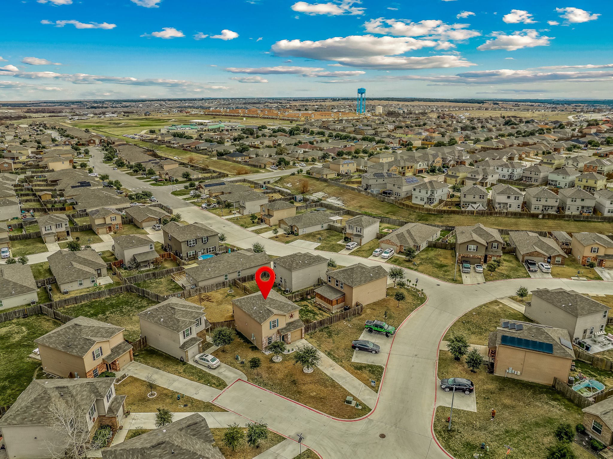 100 Wincliff Cove, Unit 13D Jarrell, TX 76537 - Photo 21 of 21 Aerial perspective, noting the length of the driveway, and ample parking spaces right outside the home for guest parking.