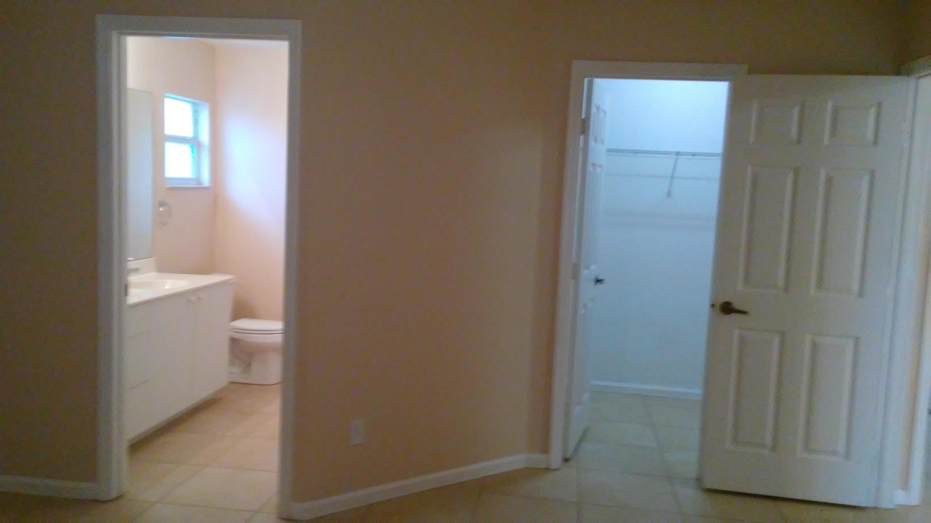 832 Southwest Duncan Terrace Port St. Lucie, FL 34953 - Photo 12 of 37 a bathroom with a toilet