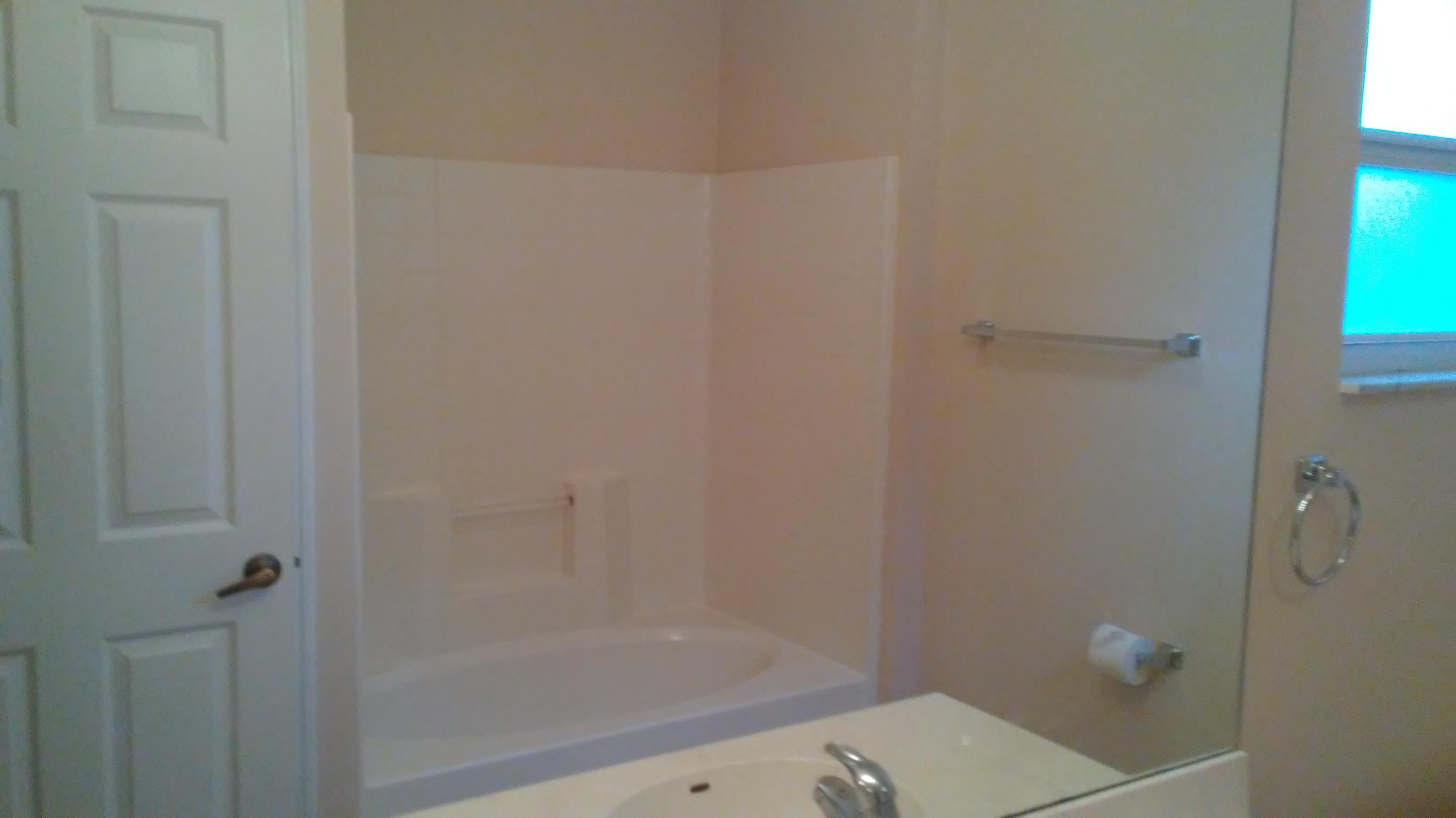 832 Southwest Duncan Terrace Port St. Lucie, FL 34953 - Photo 15 of 37 a bathroom with a bathtub