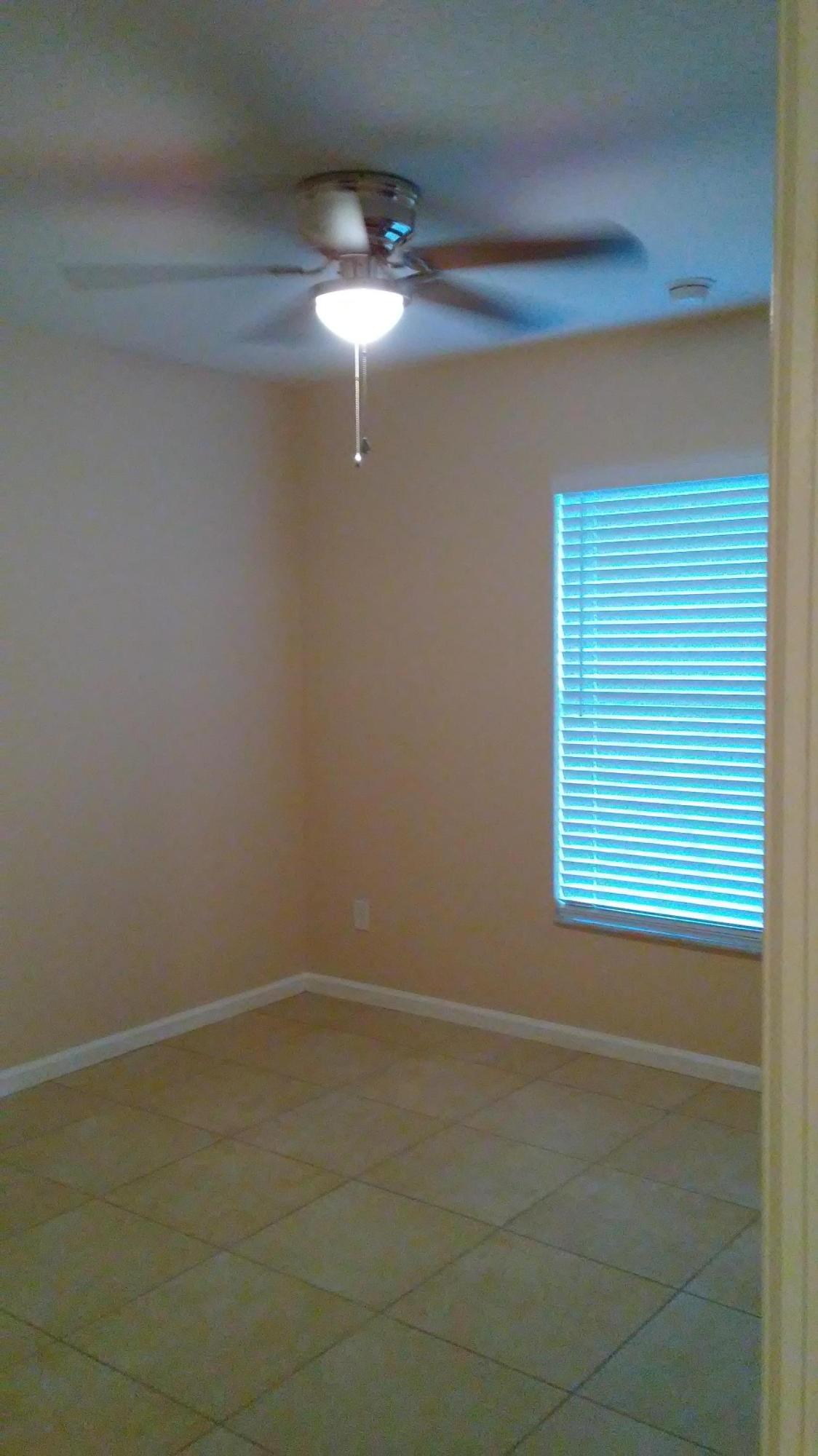 832 Southwest Duncan Terrace Port St. Lucie, FL 34953 - Photo 17 of 37 a view of a room with a fan