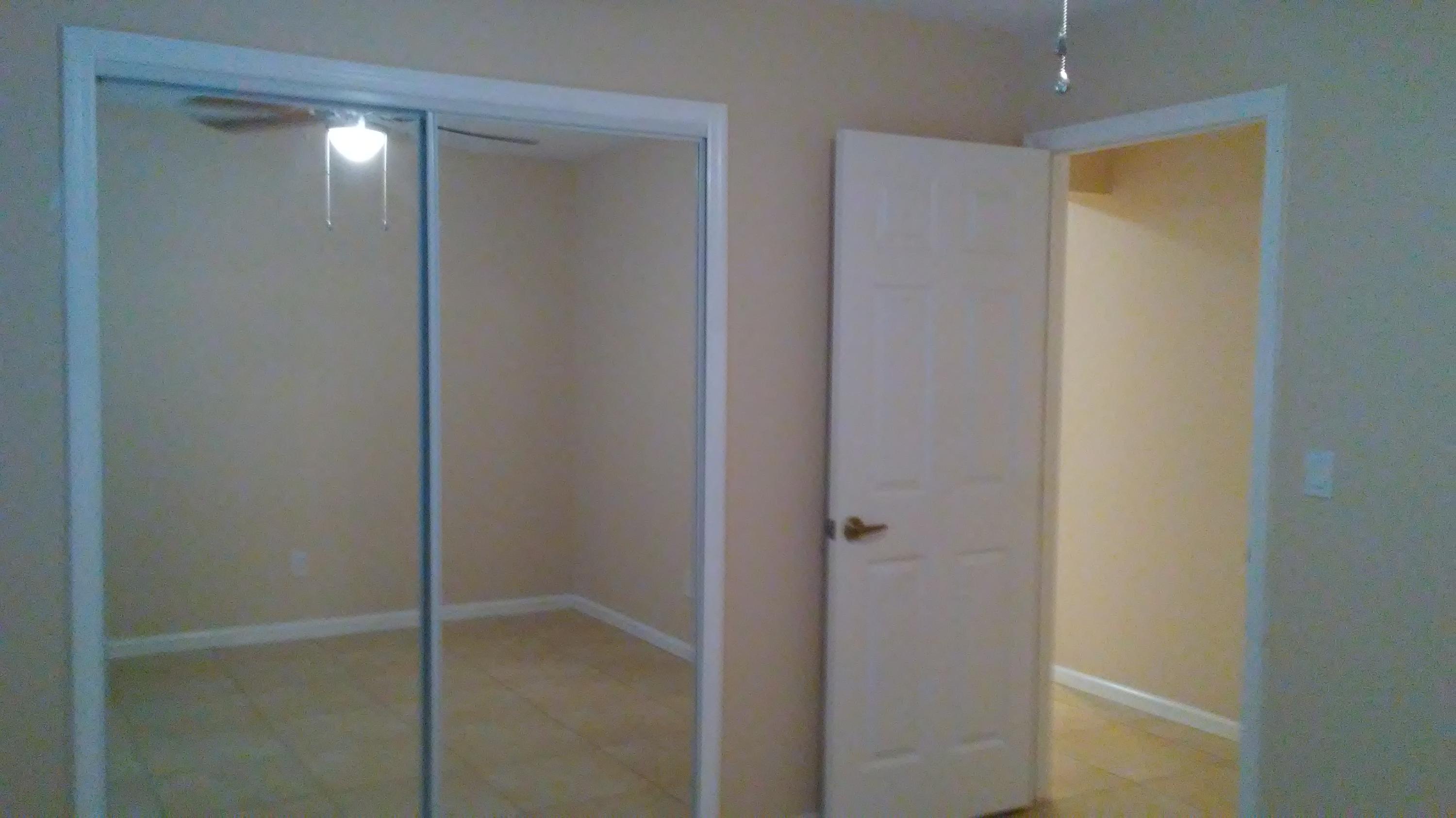 832 Southwest Duncan Terrace Port St. Lucie, FL 34953 - Photo 18 of 37 a bathroom with a glass shower door