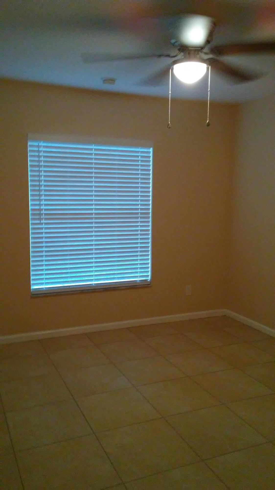 832 Southwest Duncan Terrace Port St. Lucie, FL 34953 - Photo 19 of 37 a view of a room that has a window in it