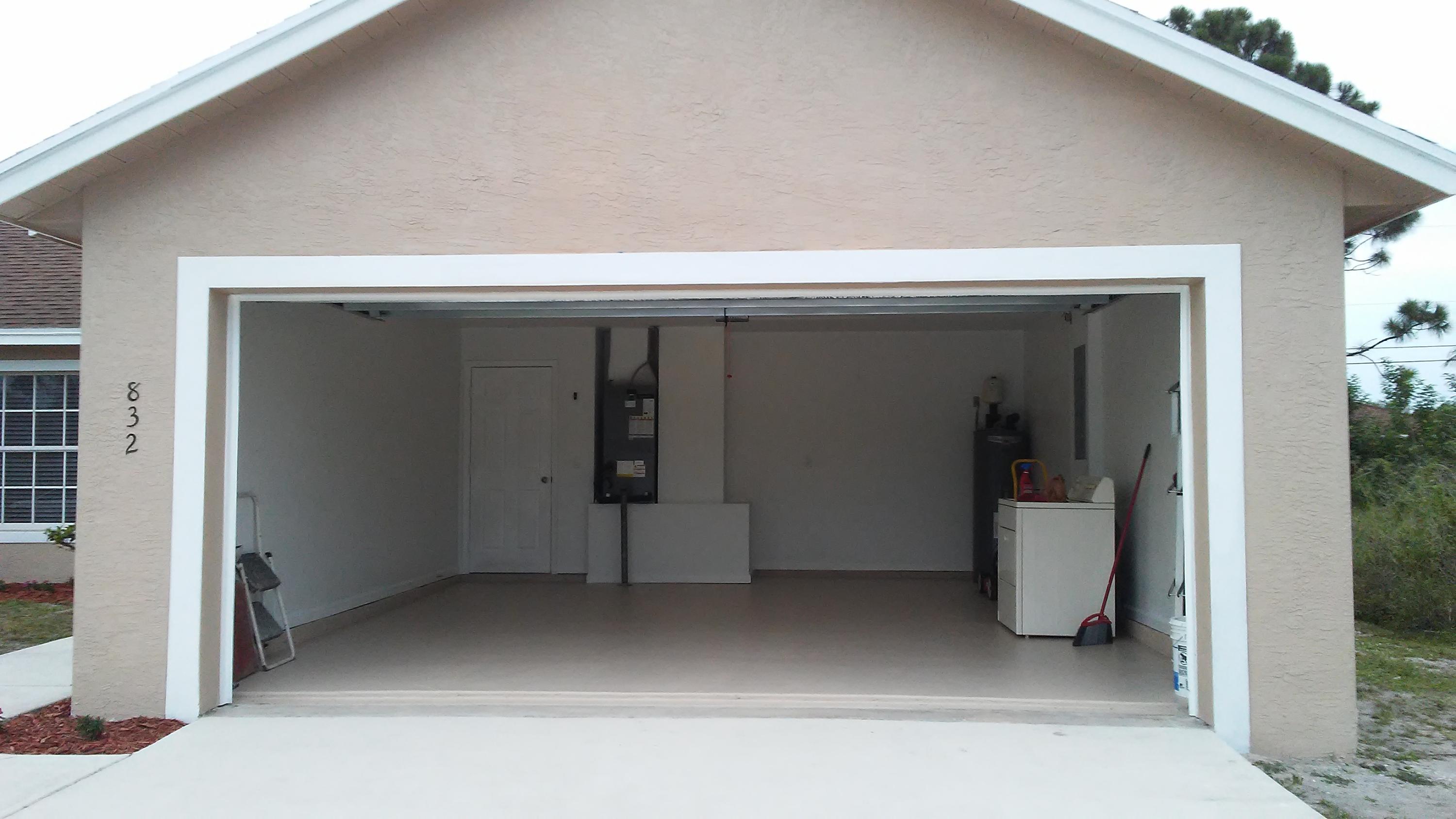 832 Southwest Duncan Terrace Port St. Lucie, FL 34953 - Photo 30 of 37 a view of a car garage door