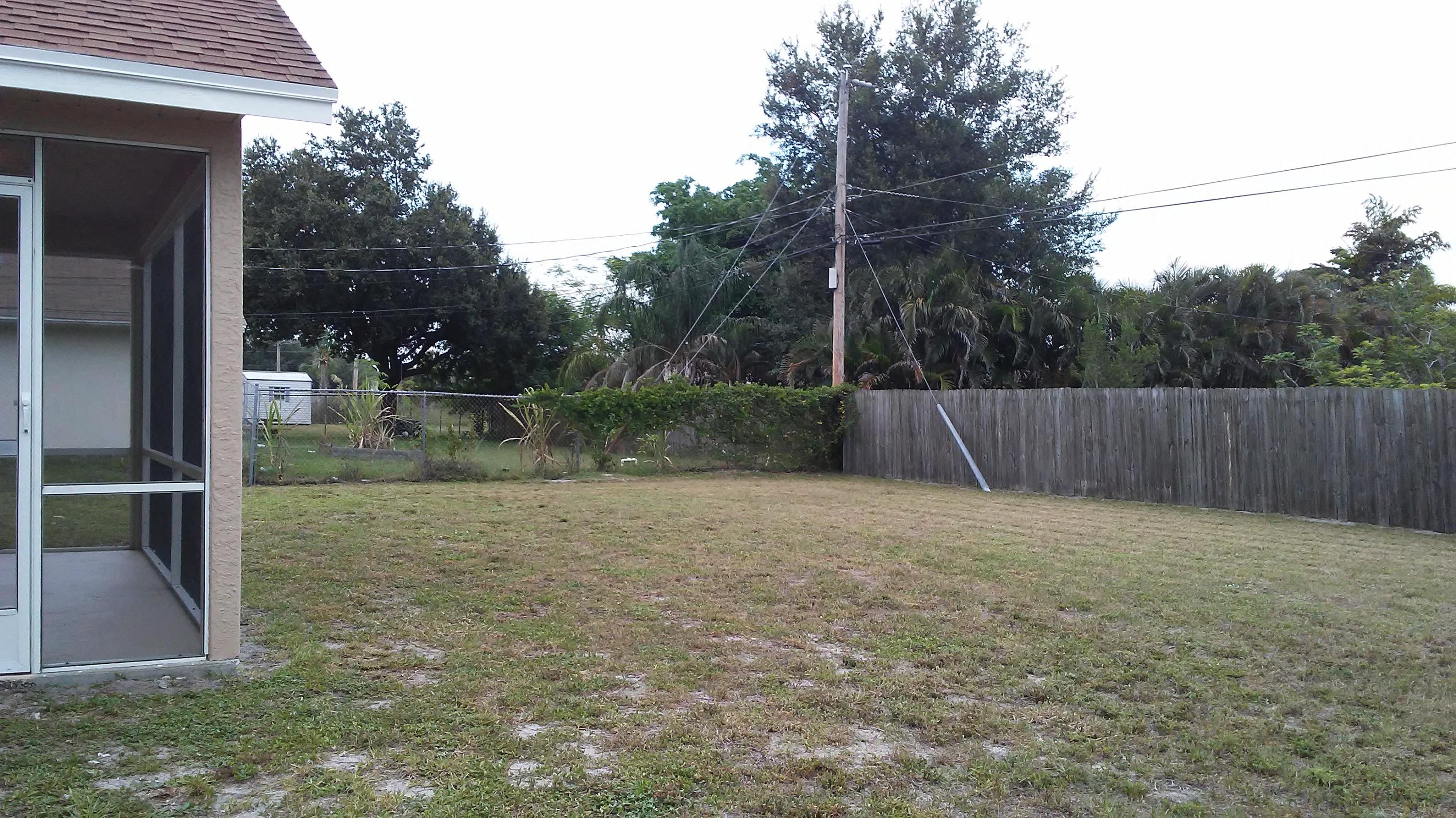 832 Southwest Duncan Terrace Port St. Lucie, FL 34953 - Photo 36 of 37 a backyard of a house