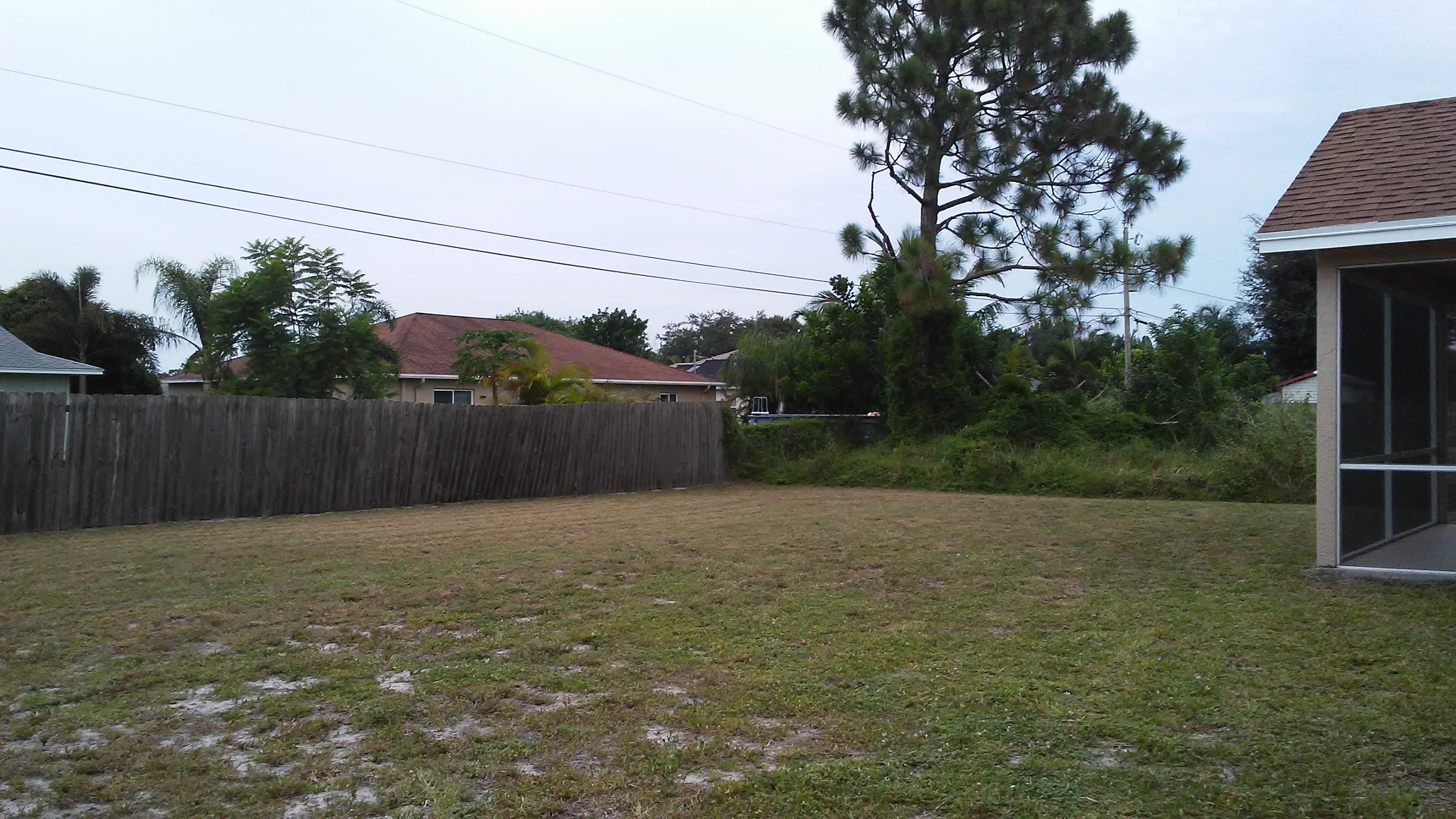 832 Southwest Duncan Terrace Port St. Lucie, FL 34953 - Photo 37 of 37 a backyard of a house with lots of green space