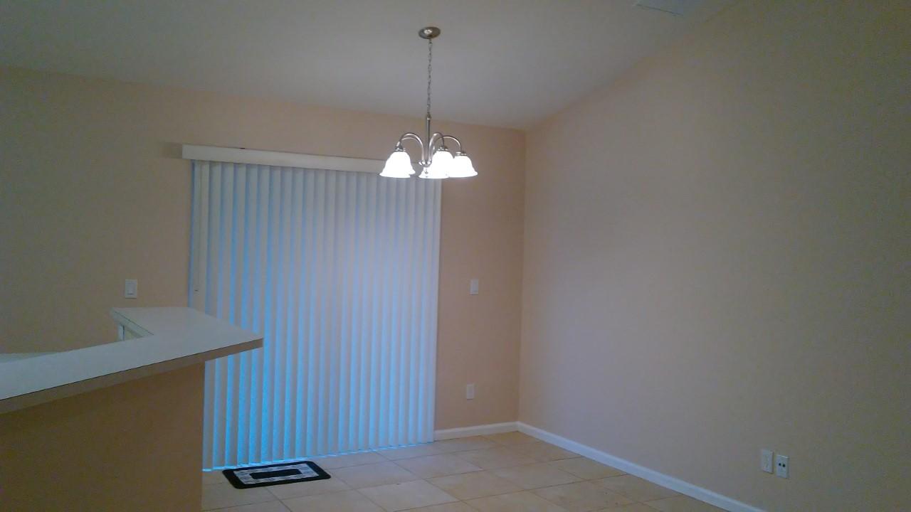 832 Southwest Duncan Terrace Port St. Lucie, FL 34953 - Photo 6 of 37 a view of a room with chandelier fan