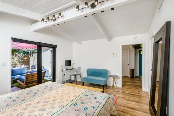 a bed room with a bed and a chair