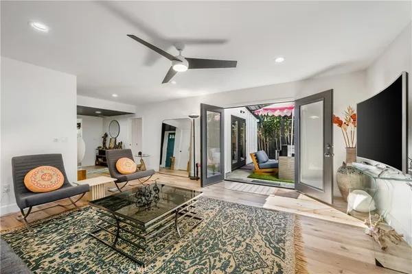 a living room with couch and a flat screen tv